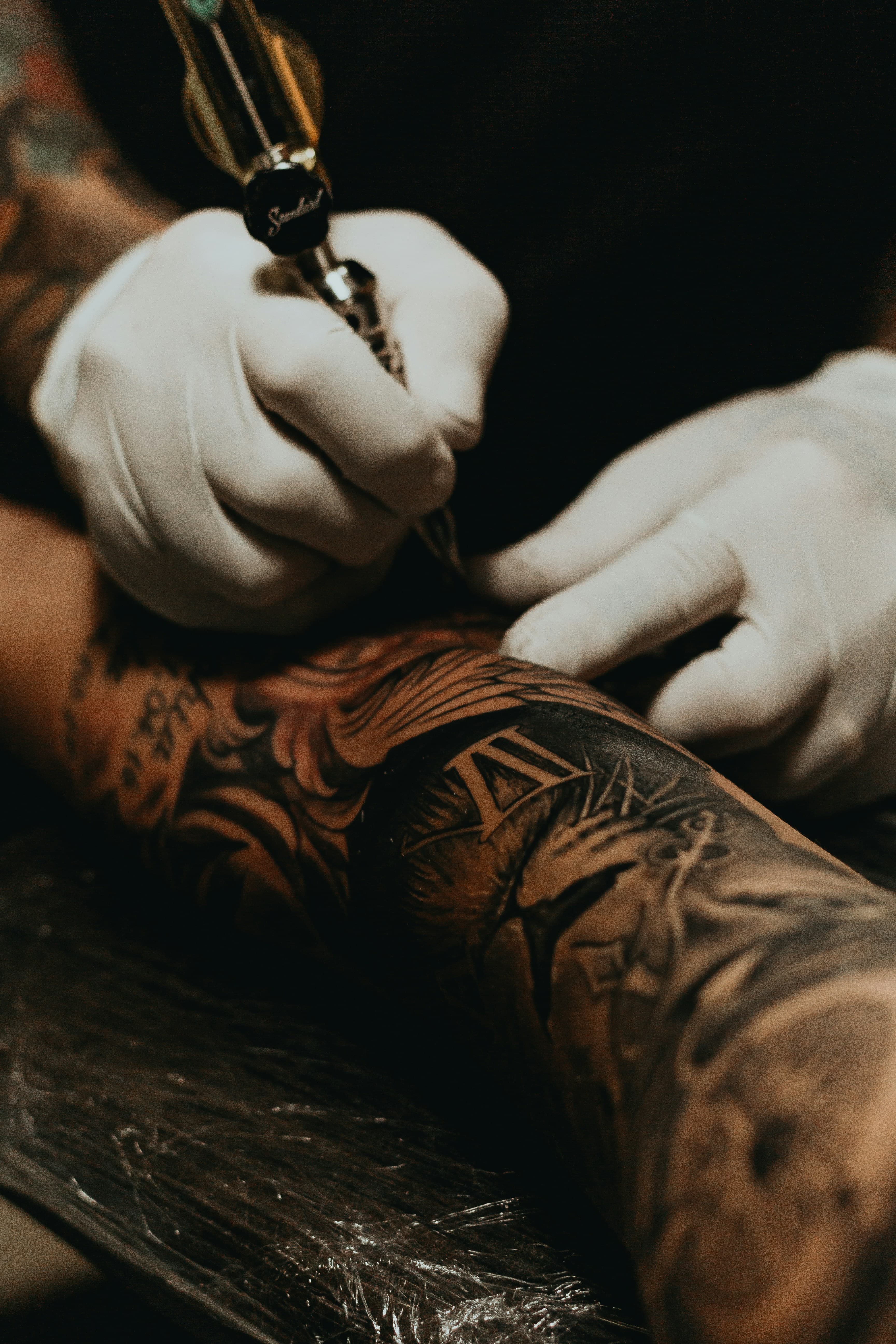 Professional tattoo artist at work